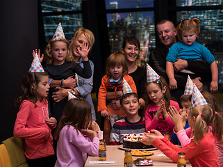 Image showing happy young boy having birthday party