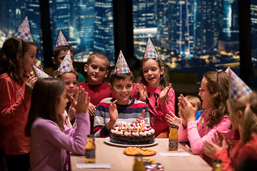 Image showing happy young boy having birthday party