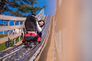 Image showing couple driving on alpine coaster