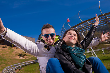 Image showing couple driving on alpine coaster