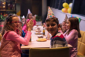 Image showing The young boy joyfully celebrating his birthday