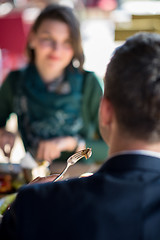 Image showing youn couple enjoying lunch at restaurant