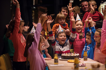 Image showing happy young boy having birthday party