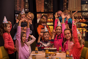 Image showing happy young boy having birthday party