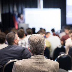 Image showing Business speaker giving a talk at business conference event.