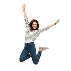 Image showing happy young woman or teenage girl jumping