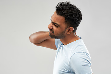 Image showing unhealthy indian man suffering from neck pain