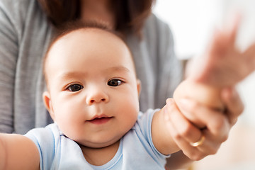 Image showing close up of asian baby boy with mother