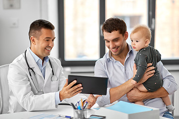 Image showing father with baby and doctor with tablet at clinic