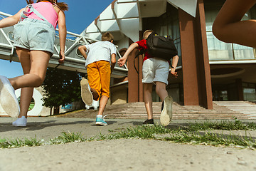 Image showing Happy kids playing at city\'s street in sunny summer\'s day