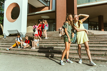 Image showing Happy kids playing at city\'s street in sunny summer\'s day