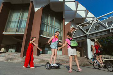 Image showing Happy kids playing at city\'s street in sunny summer\'s day