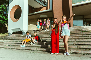 Image showing Happy kids playing at city\'s street in sunny summer\'s day