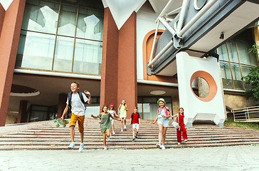 Image showing Happy kids playing at city\'s street in sunny summer\'s day