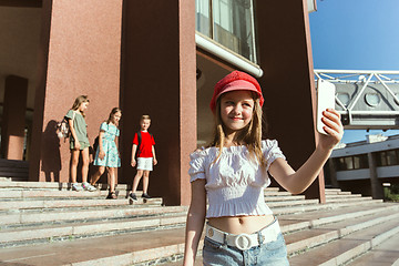 Image showing Happy kids playing at city\'s street in sunny summer\'s day