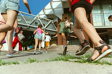 Image showing Happy kids playing at city\'s street in sunny summer\'s day