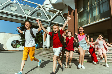 Image showing Happy kids playing at city\'s street in sunny summer\'s day