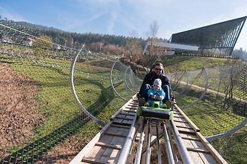 Image showing father and son enjoys driving on alpine coaster