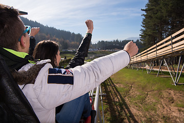 Image showing couple enjoys driving on alpine coaster