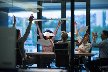 Image showing multiethnic Group of young business people throwing documents