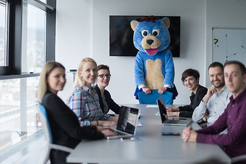 Image showing boss dresed as bear having fun with business people in trendy of