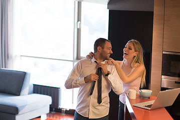 Image showing A young couple is preparing for a job and using a laptop