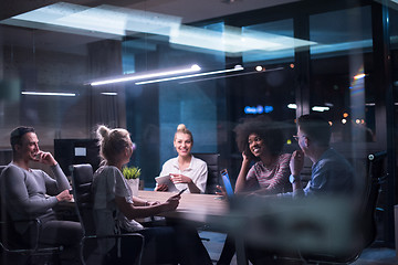 Image showing Multiethnic startup business team in night office