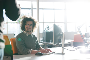 Image showing businessman working using a computer in startup office