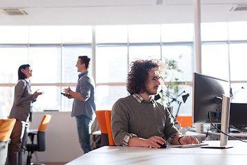 Image showing businessman working using a computer in startup office