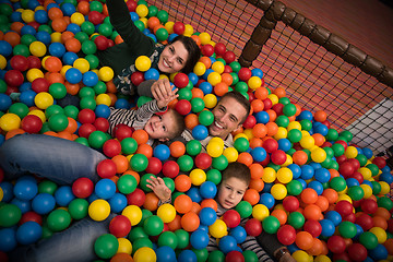 Image showing young parents with kids in a children\'s playroom