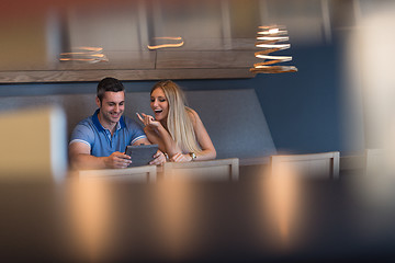 Image showing couple using tablet at home