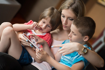 Image showing Young Family Using A Tablet To Make Future Plans