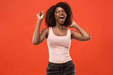 Image showing Winning success woman happy ecstatic celebrating being a winner. Dynamic energetic image of female afro model