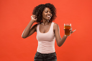 Image showing Sexy young afro woman drinking beer, not isolated on white background