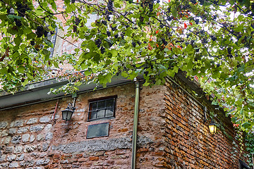 Image showing old brick building with lanterns