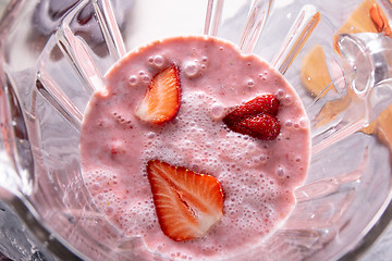 Image showing healthy red smoothie with strawberries, yoghurt and chia seeds in glass jars blender, top view