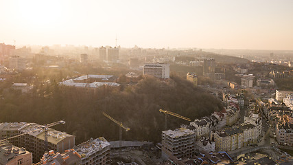 Image showing Artistic Kiev School and Construction workers at work are at the top of the building on Vozdvizhenka in Kiev