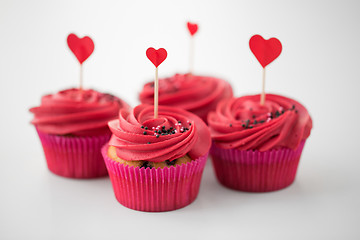 Image showing close up of cupcakes with heart cocktail sticks