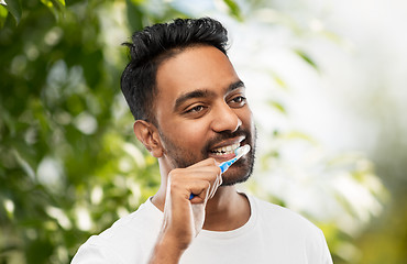 Image showing indian man with toothbrush cleaning teeth