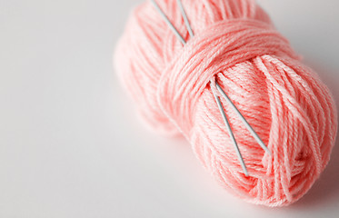 Image showing knitting needles and ball of pink yarn