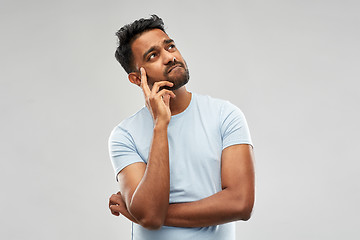 Image showing indian man thinking and looking up