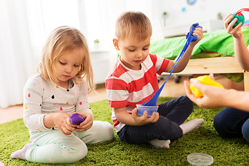 Image showing children with modelling clay or slimes at home