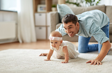 Image showing happy little baby girl with father at home