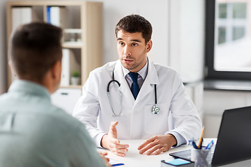 Image showing doctor with laptop and male patient at hospital