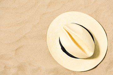 Image showing straw hat on beach sand