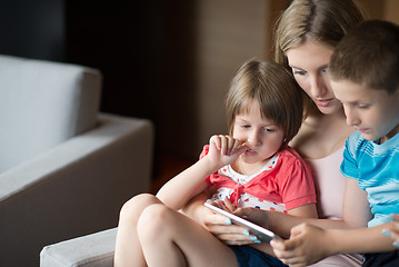 Image showing Young Family Using A Tablet To Make Future Plans