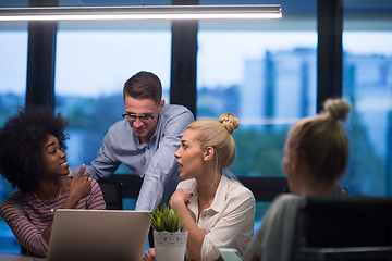 Image showing Multiethnic startup business team in night office