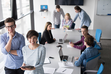 Image showing Two Business People Working With Tablet in office