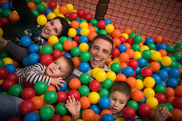 Image showing young parents with kids in a children\'s playroom