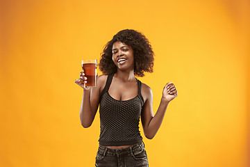 Image showing Sexy young afro woman drinking beer, not isolated on white background